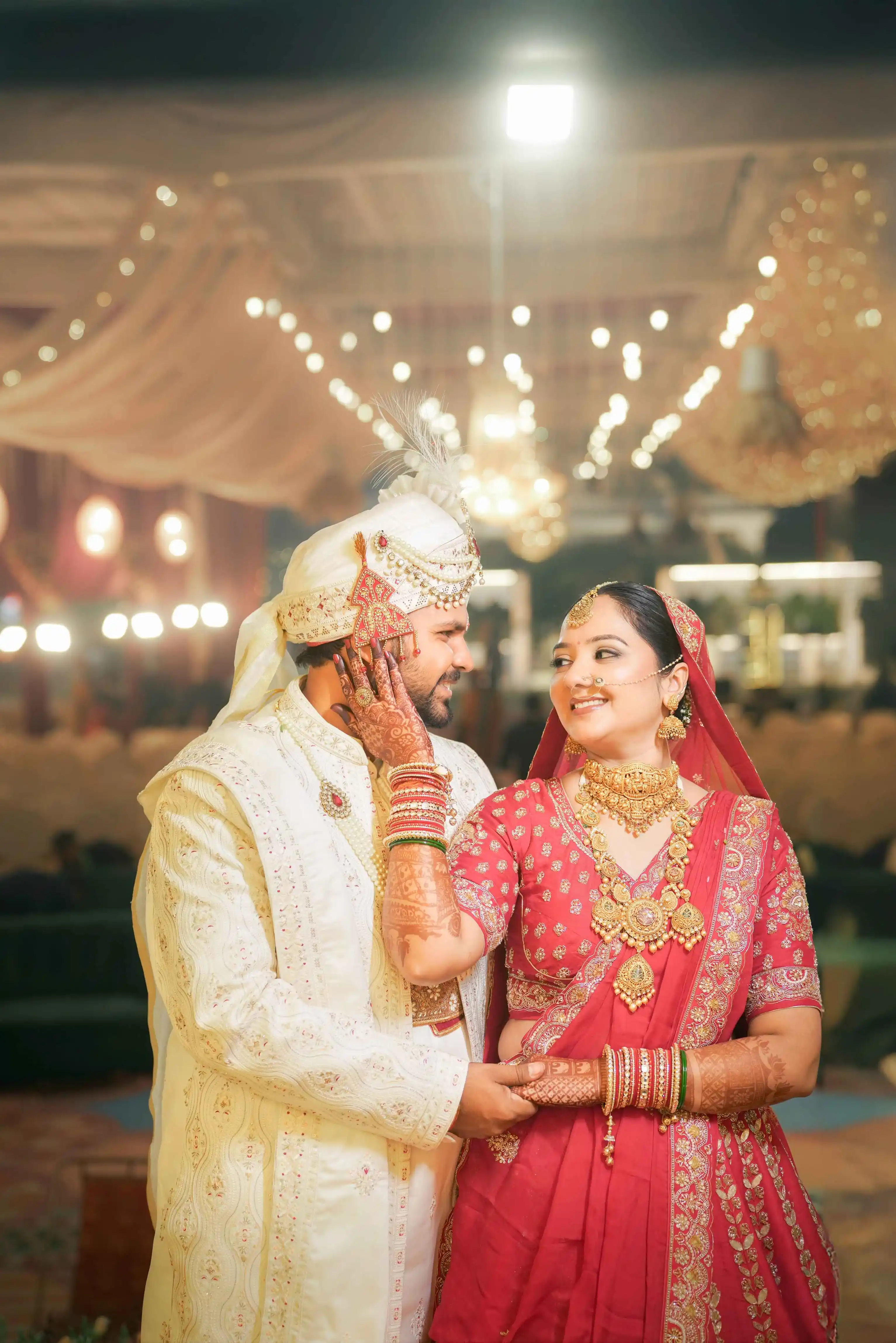 Bride looking at her wedding album with a smile of nostalgia