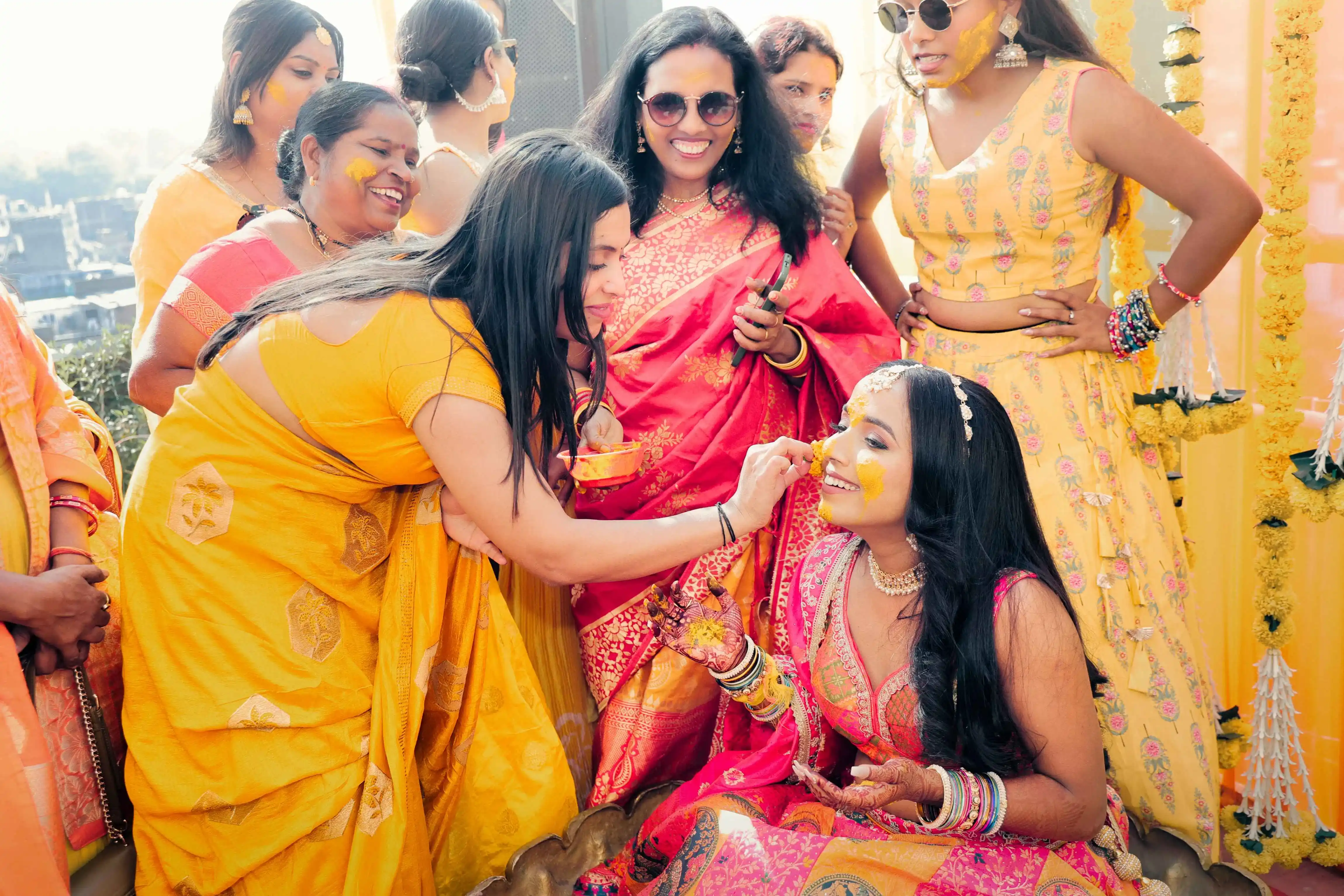Bride and groom sharing laughter during their haldi ceremony