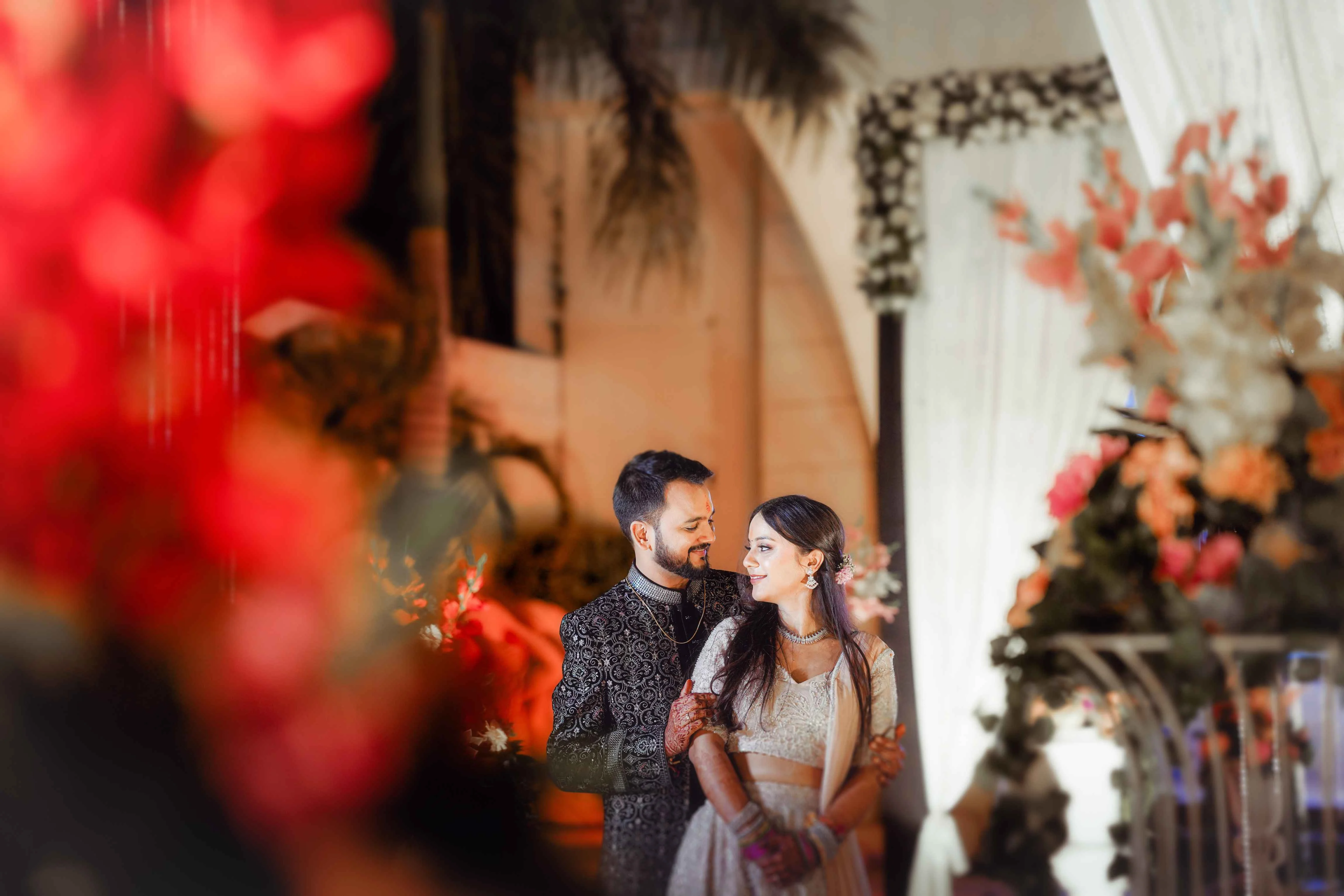 Bride and groom dancing during reception with family and guests